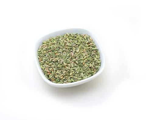 Dried fennel seeds in a white bowl